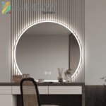 Large semi-circle with light and sandblasted bathroom mirror